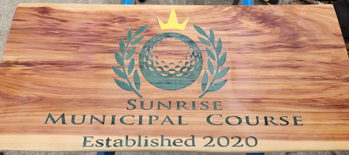 Wooden board engraved with a custom golf course design